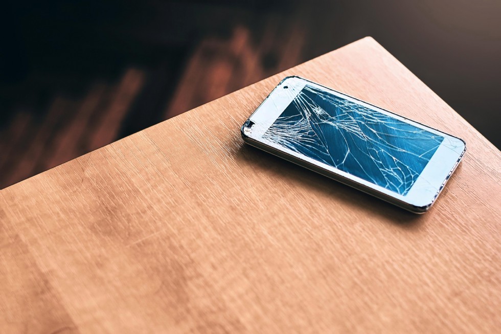 How can I fix my cracked iPhone screen at home?
