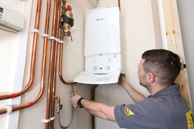 How often should I replace my water heater, and what are the signs that it is failing?