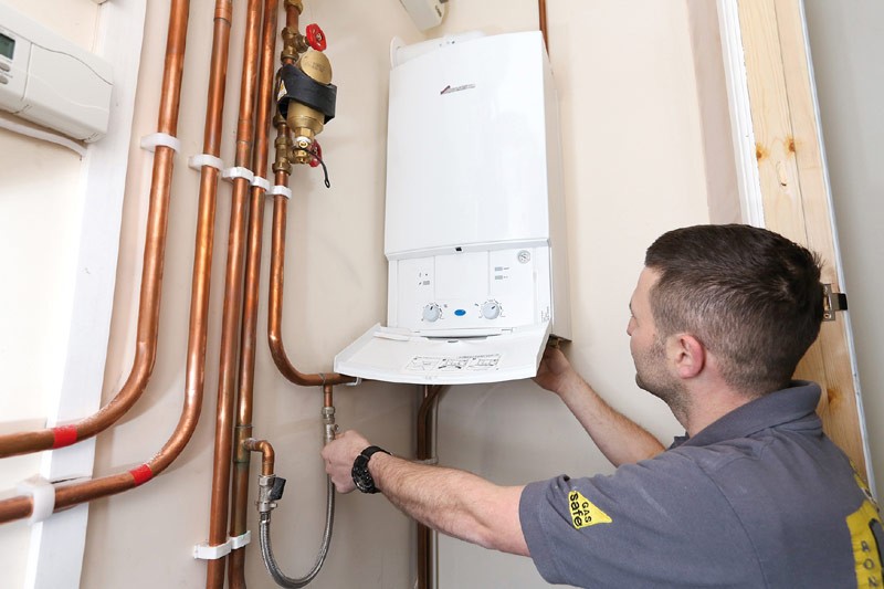 How often should I replace my water heater, and what are the signs that it is failing?
