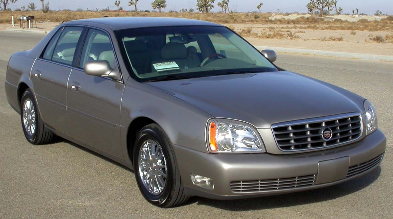 The oil capacity and recommended oil type for a Cadillac DeVille