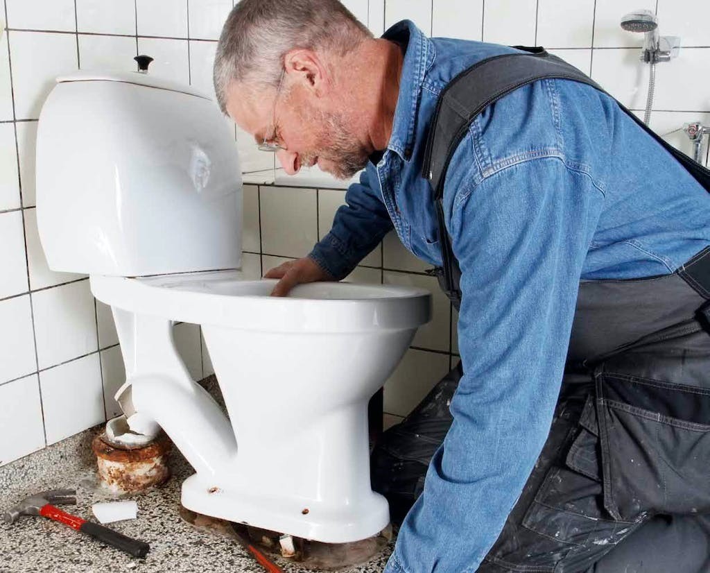 What are the steps involved in replacing a toilet?