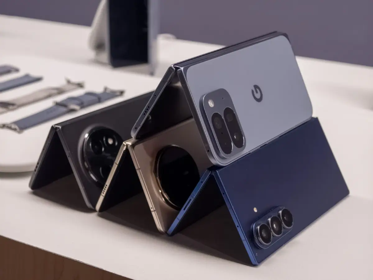 Side-by-side unfolded view of Google Pixel 10 Pro Fold, Galaxy Z Fold 7, Honor Magic V5, and Oppo Find N5 showing design
