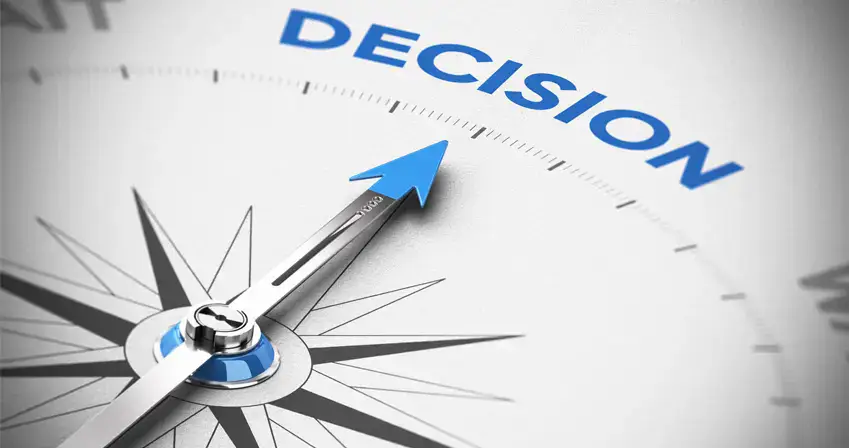 Compass pointing to the word DECISION with blue arrow