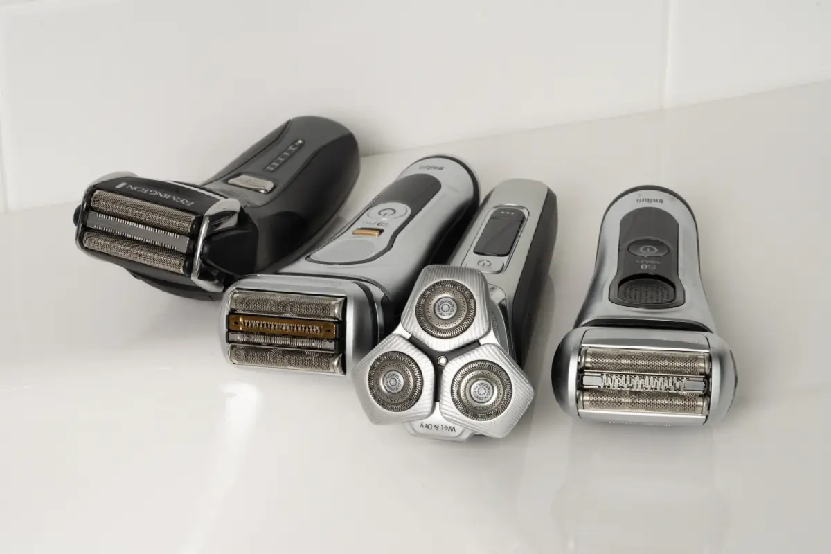 Several modern electric foil shavers displayed side by side on a clean white background for grooming comparison