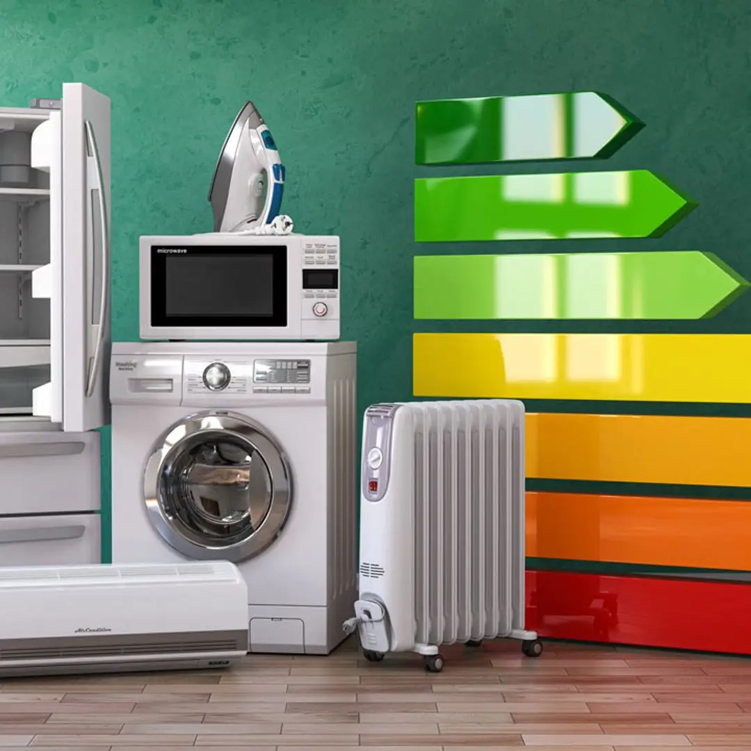 Modern energy-saving devices including smart plugs, monitors, and efficient appliances for lower electricity bills