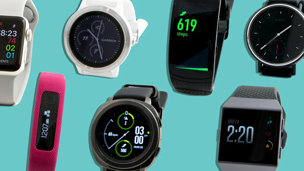 Collection of colorful fitness trackers and smartwatches on wrist and background