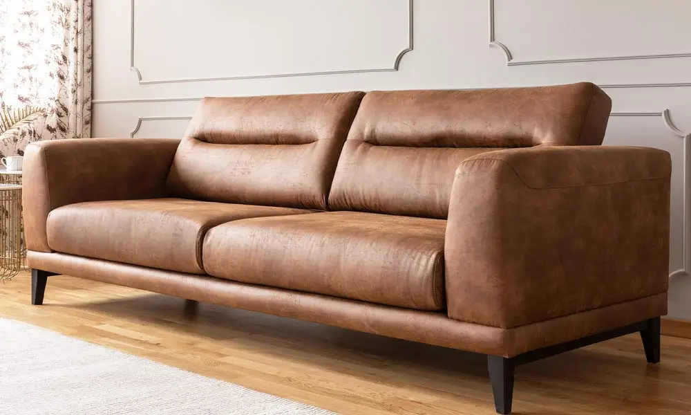 Close-up of luxurious tan leather sofa showing professional deep cleaning results