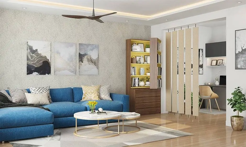 Modern living room with neutral tones, plush sofa, coffee table, chandelier, and ambient lighting