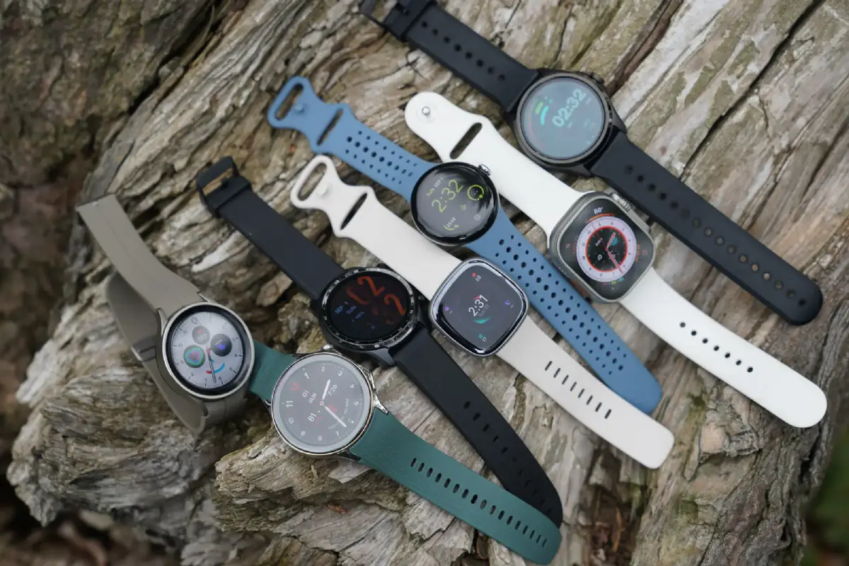 Array of top smartwatches from Apple, Samsung, Google, and others arranged for comparison on a neutral background